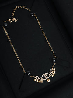 Gold CC Spellout heart rhinestone necklace