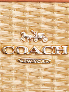 Coach Neutral and coral raffia and leather crossbody bag