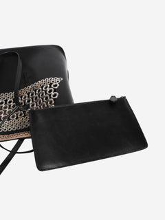 Black leather grommet tote bag