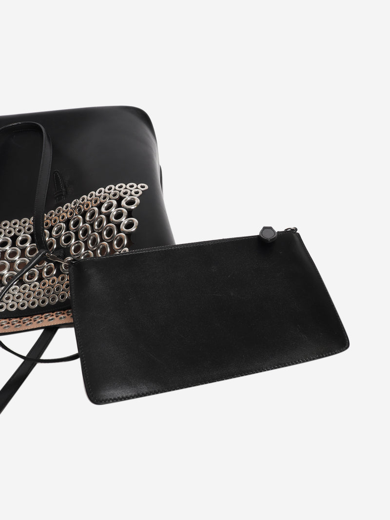 Black leather grommet tote bag