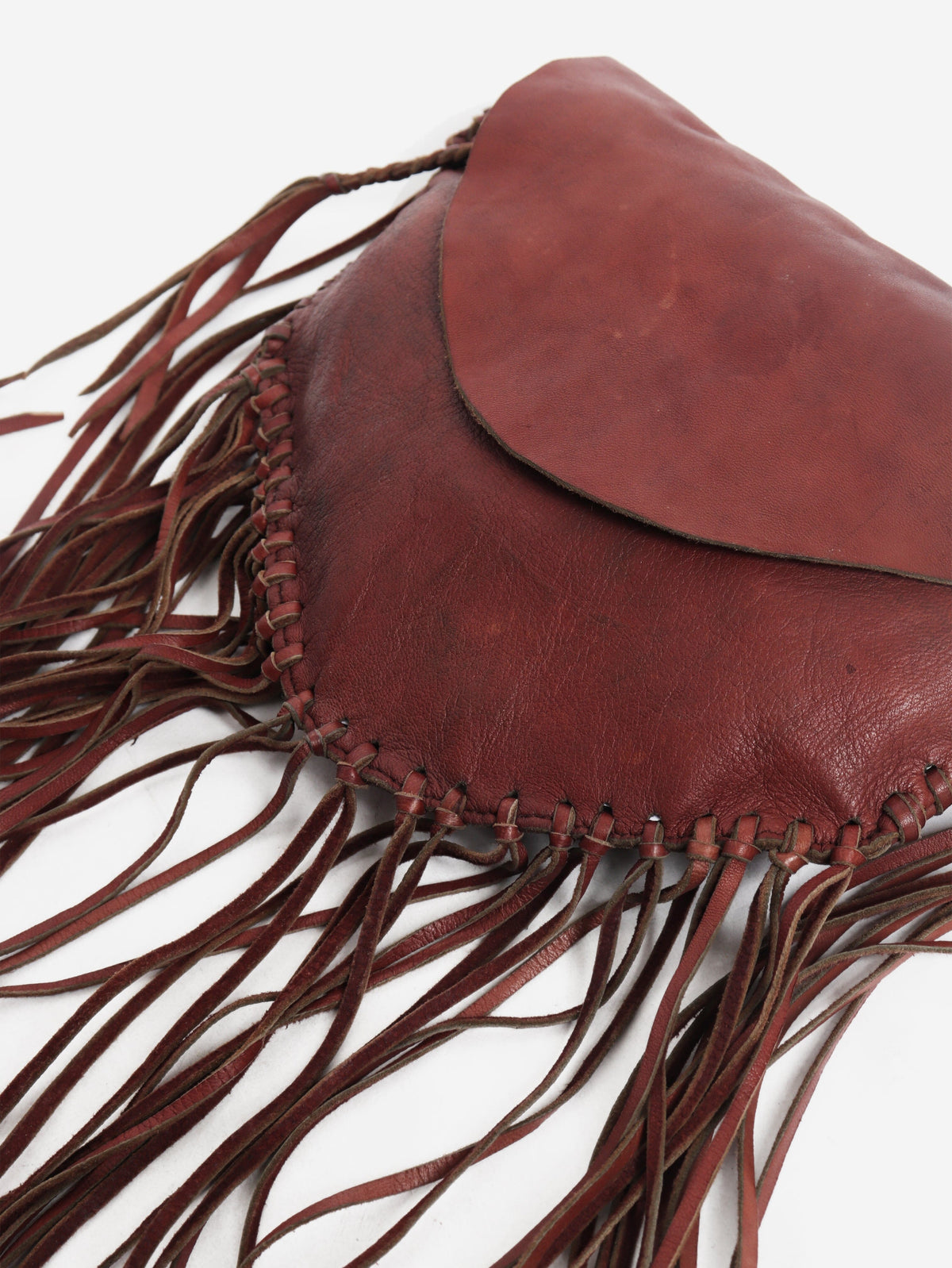 Pinkish brown leather tassel clutch bag