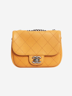 Orange 2014 diamond-quilted mini flap bag