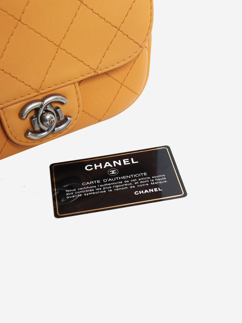 Orange 2014 diamond-quilted mini flap bag
