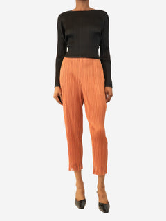 Burnt orange fringe-hem pleated trousers - size S