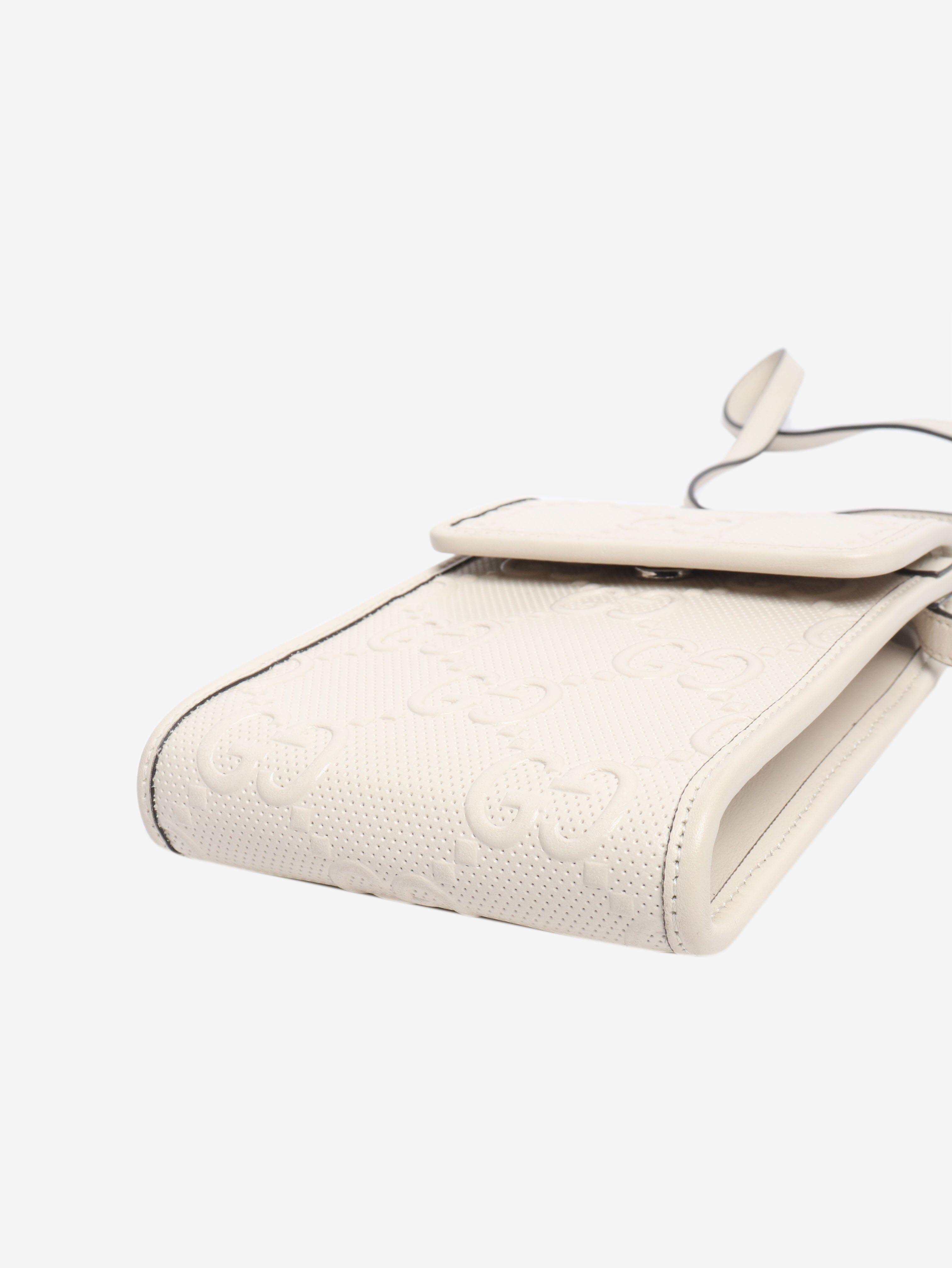 GG embossed leather mini flap crossbody bag Gucci 