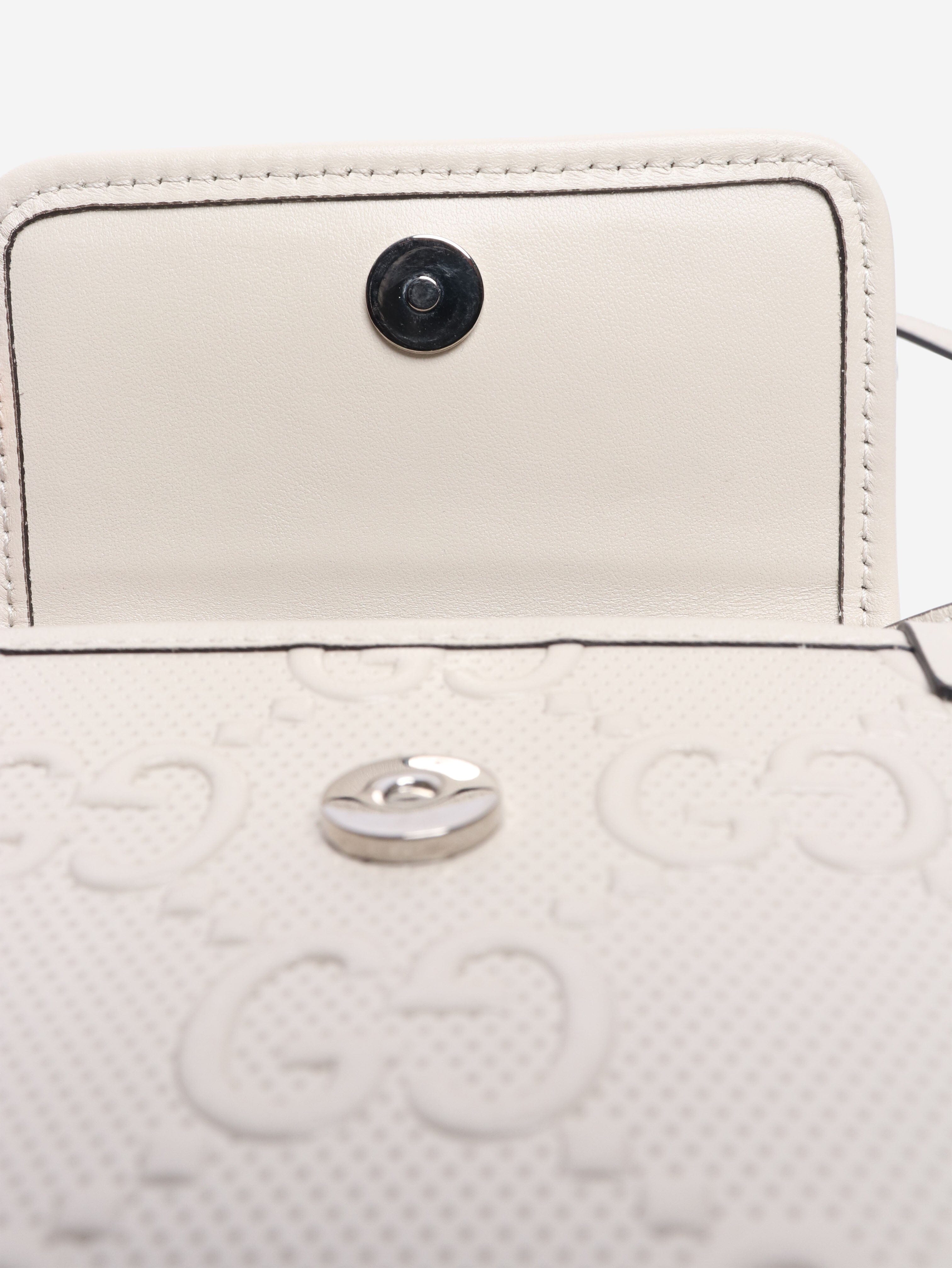 GG embossed leather mini flap crossbody bag Gucci 