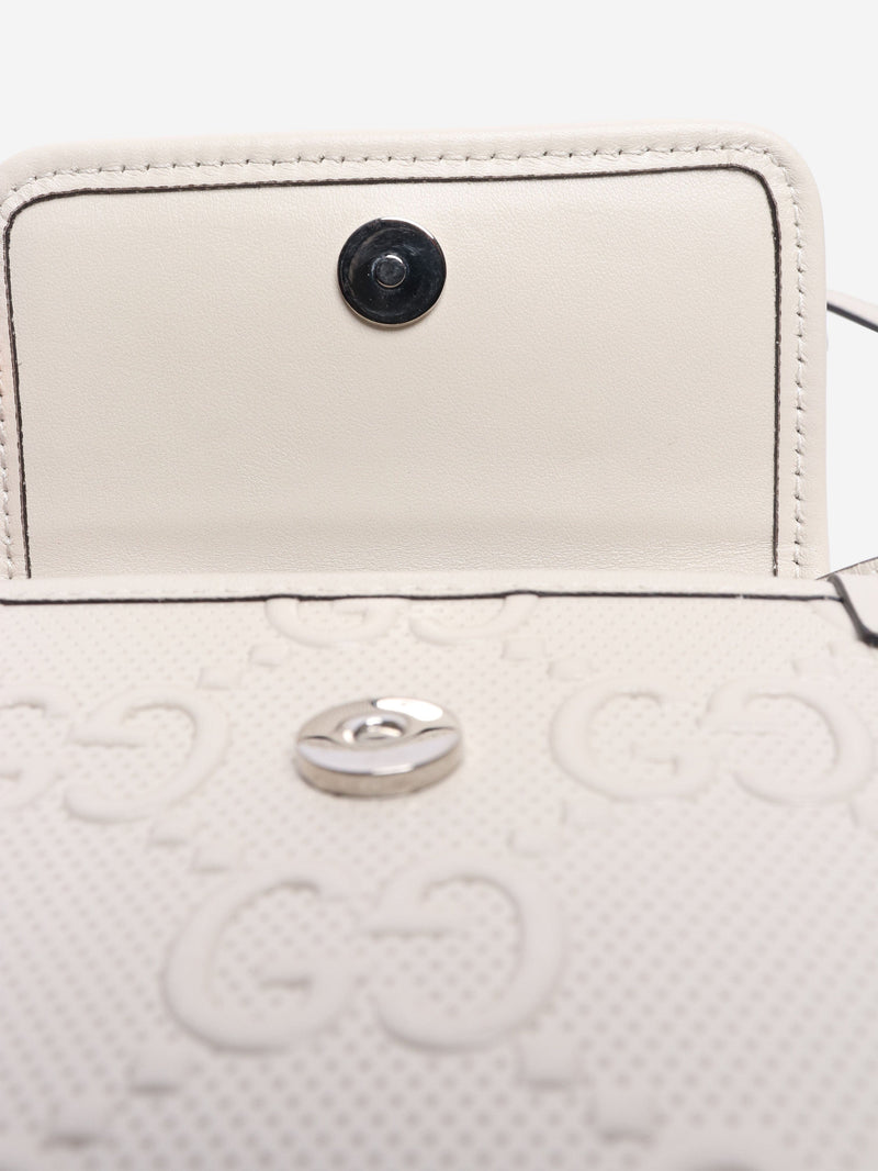 GG embossed leather mini flap crossbody bag Gucci 
