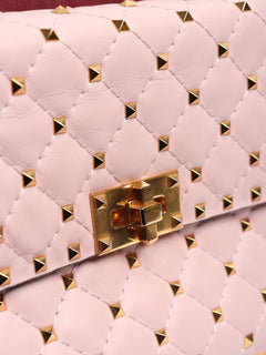 Baby pink quilted leather rockstud cross-body bag Cross-body Bags Valentino 