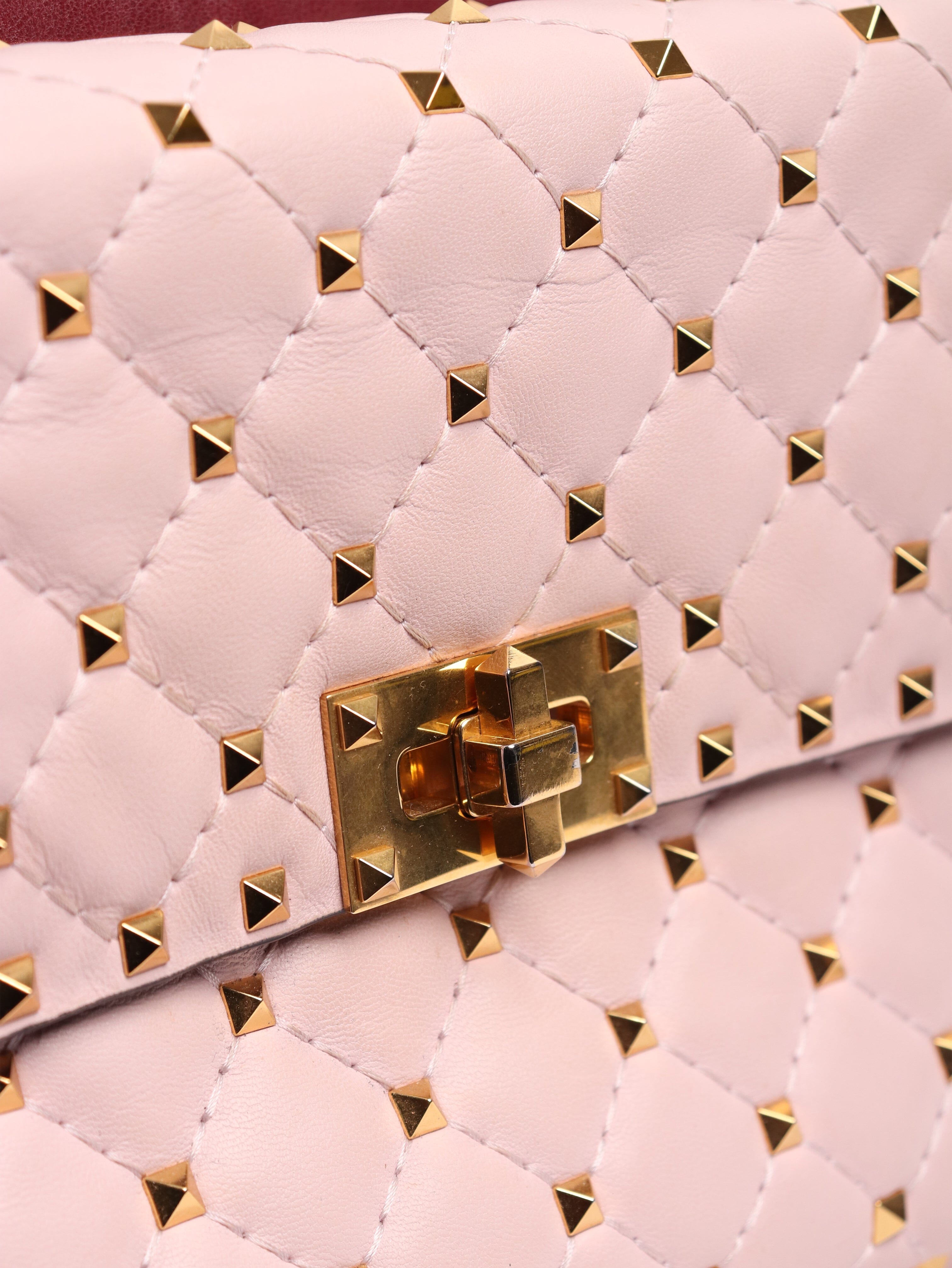 Baby pink quilted leather rockstud cross-body bag Cross-body Bags Valentino 
