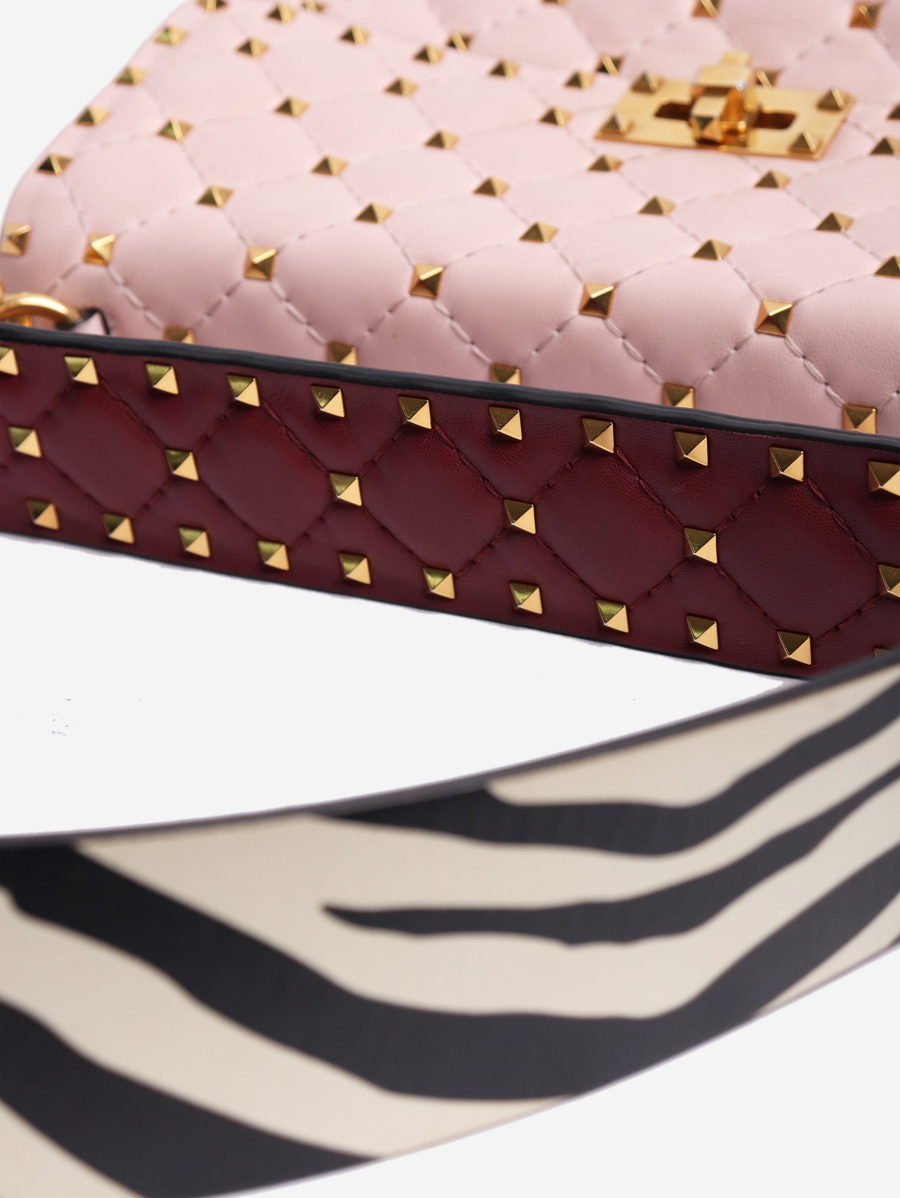 Baby pink quilted leather rockstud cross-body bag Cross-body Bags Valentino 