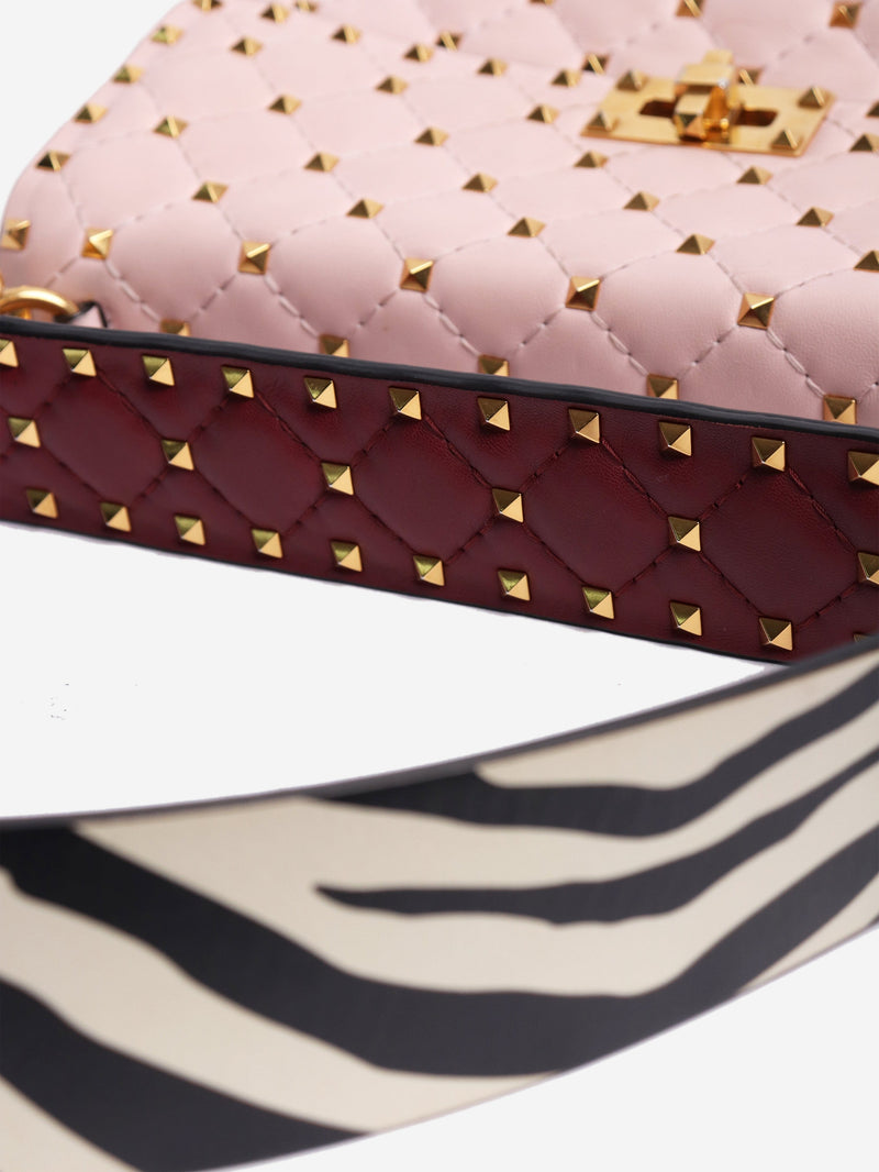 Baby pink quilted leather rockstud cross-body bag Cross-body Bags Valentino 