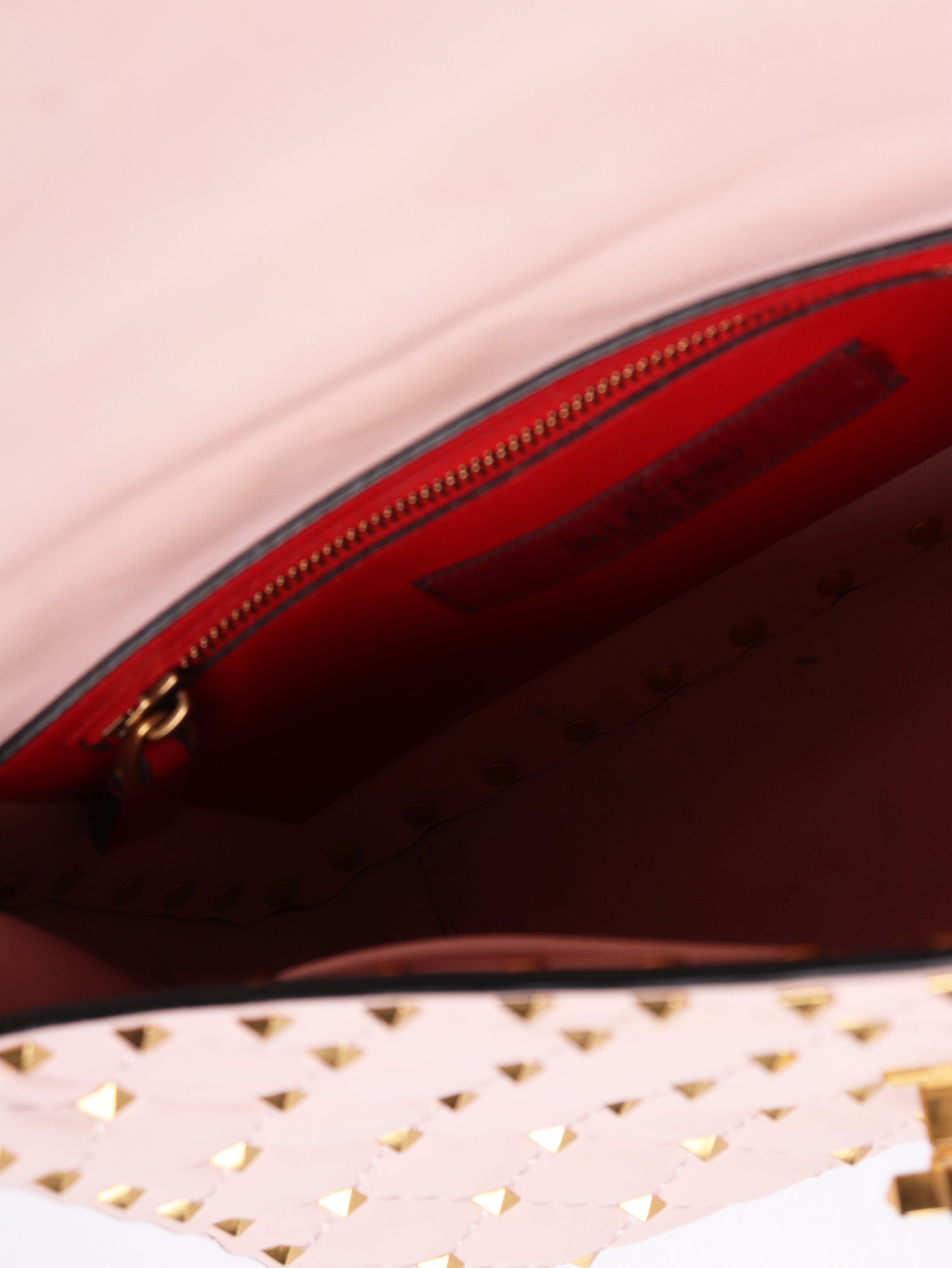 Baby pink quilted leather rockstud cross-body bag Cross-body Bags Valentino 