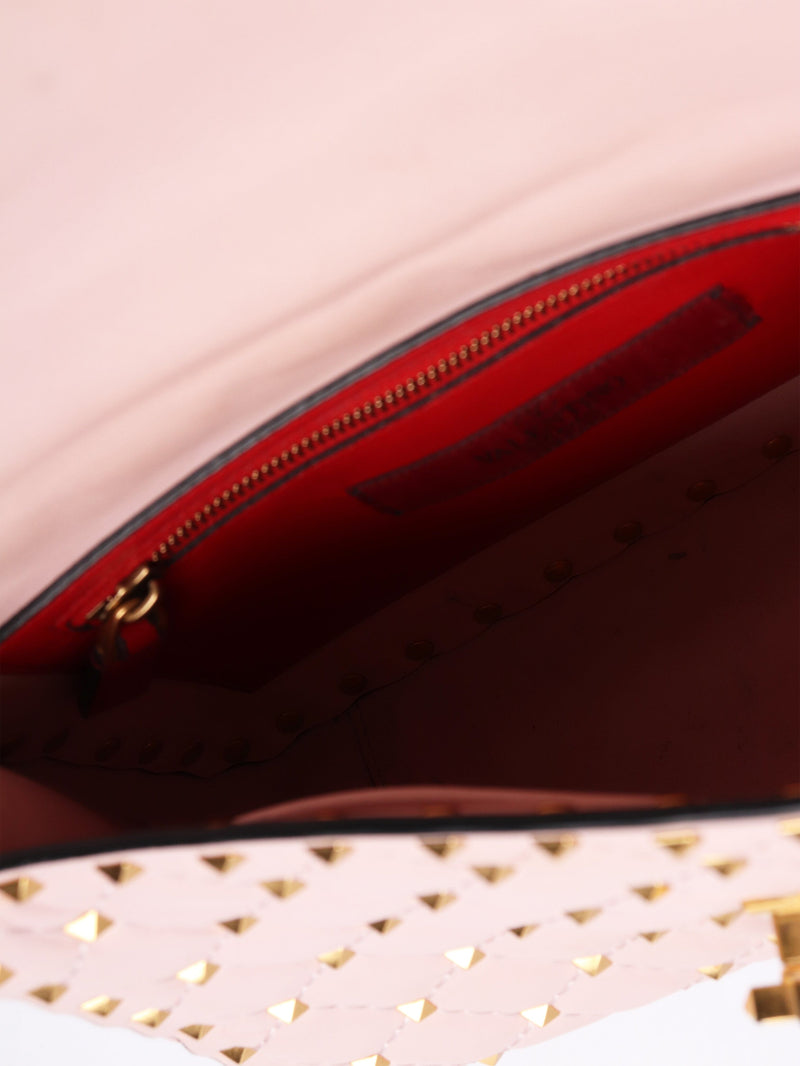 Baby pink quilted leather rockstud cross-body bag Cross-body Bags Valentino 