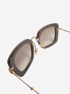 Miu Miu Black and gold gradient sunglasses