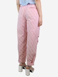 Alexander Wang Pink all-over flocked logo trousers - size M