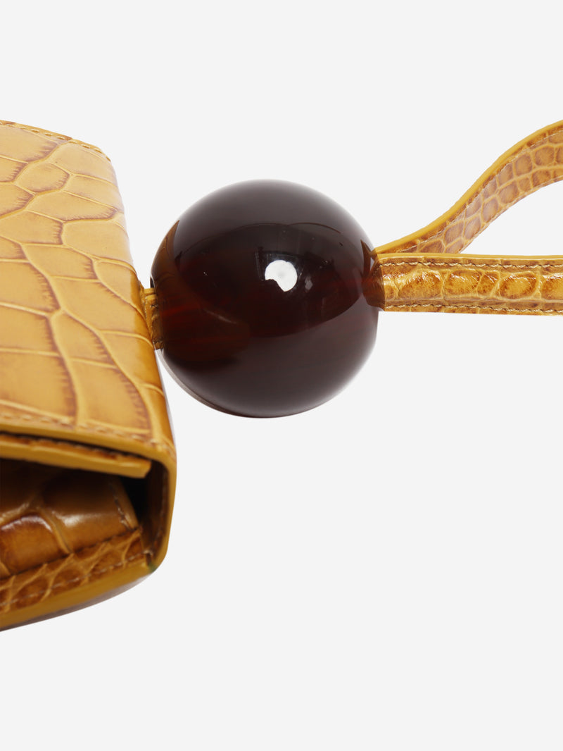 Mustard croc-embossed leather clutch bag