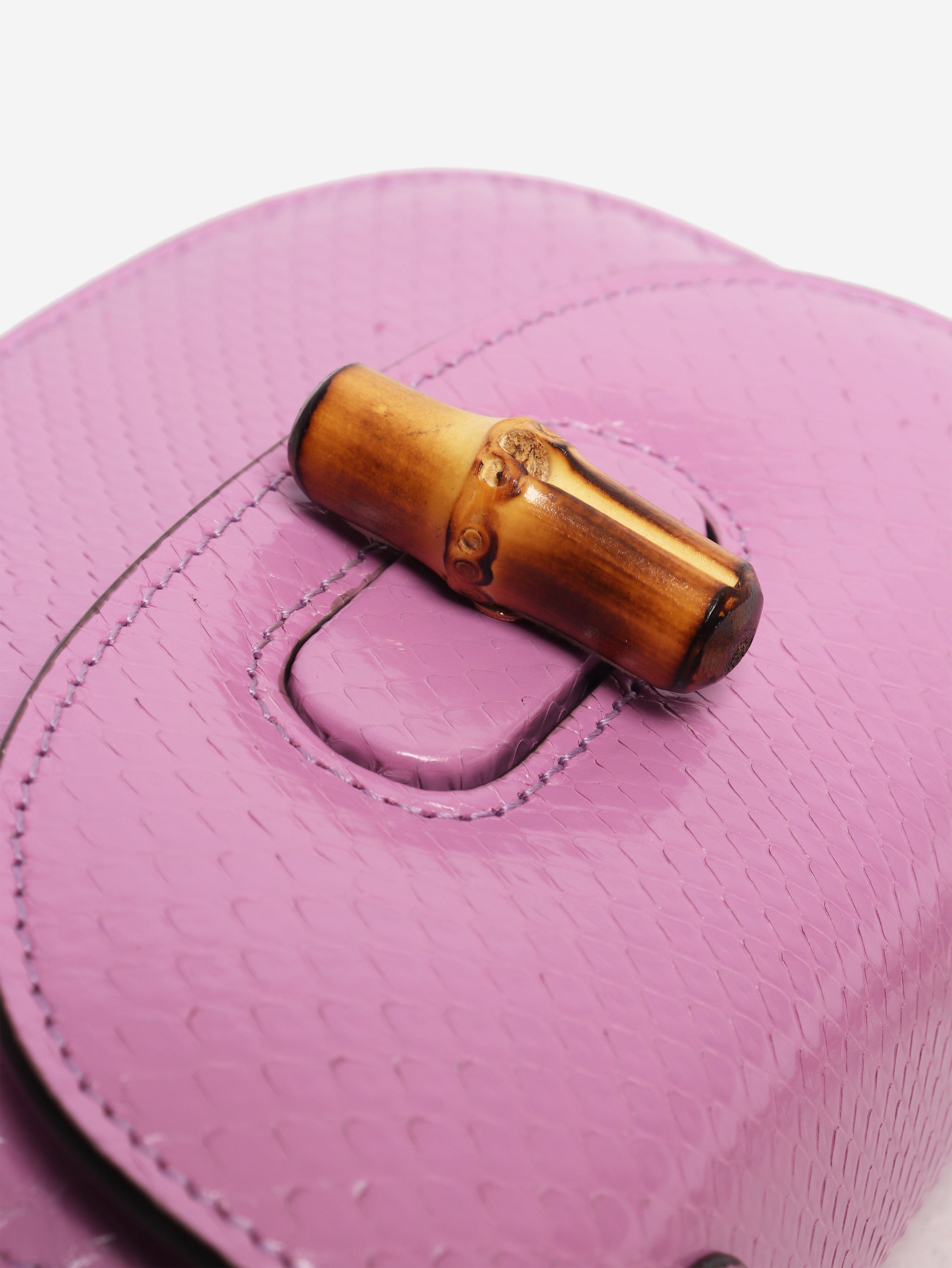 Purple bamboo handle leather bag