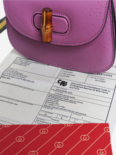 Purple bamboo handle leather bag
