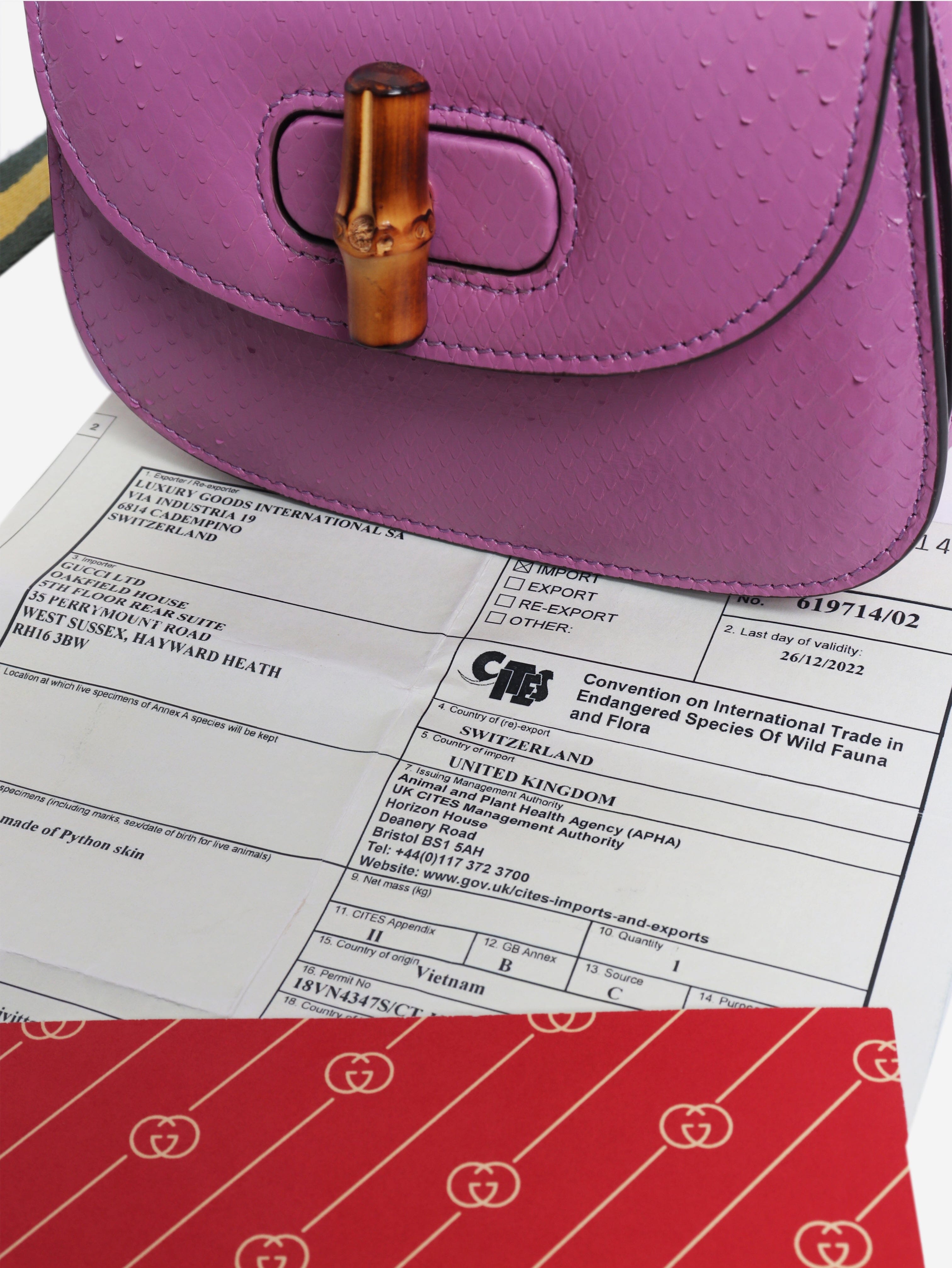 Purple bamboo handle leather bag