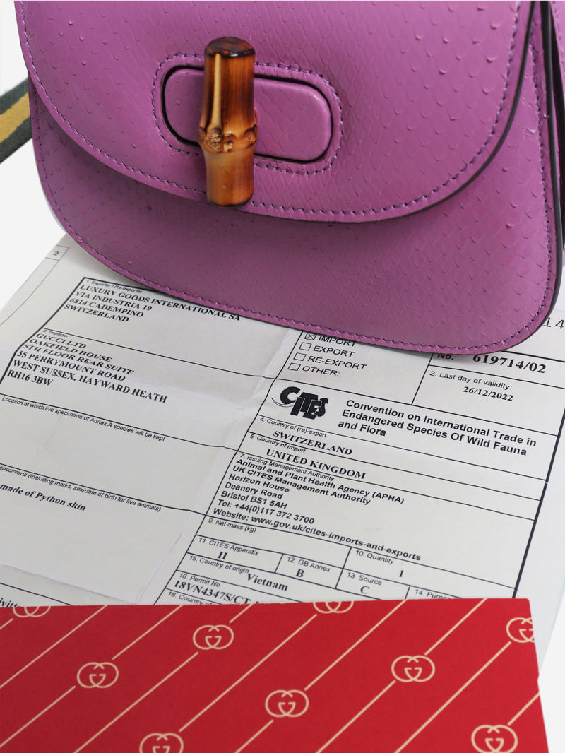 Purple bamboo handle leather bag