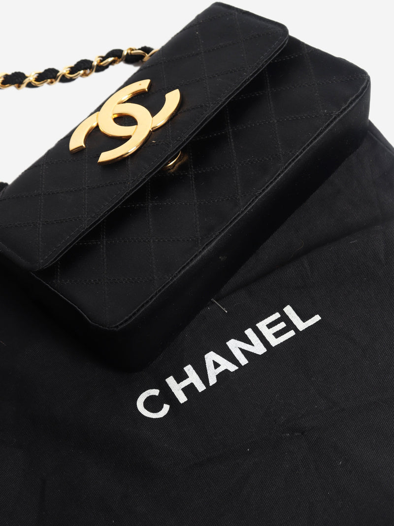 Black vintage 1986 satin quilted CC flap cross-body bag Shoulder bags Chanel 